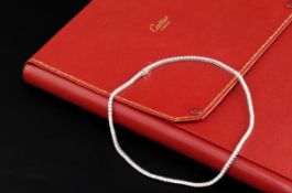 A modern Cartier 18ct white gold and diamond line choker necklace, with Cartier box and