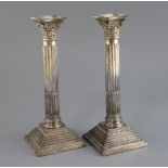 A pair of 1960's silver corinthian column candlesticks, 26.3cm, Payne & Son, Sheffield, 1964,