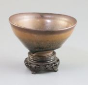 A Chinese Jian type hare's fur bowl, Qing dynasty, D. 12.3cm, wood stand