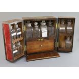 An early 19th century brass mounted mahogany apothecary chest, fitted with eleven (ex. twelve) glass