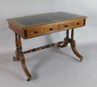 A Regency parcel ebonised oak writing table, with tooled green leather skiver and two frieze