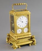 Grohe of London. A Victorian ormolu hour repeating calendar carriage clock, in ornate engraved gorge