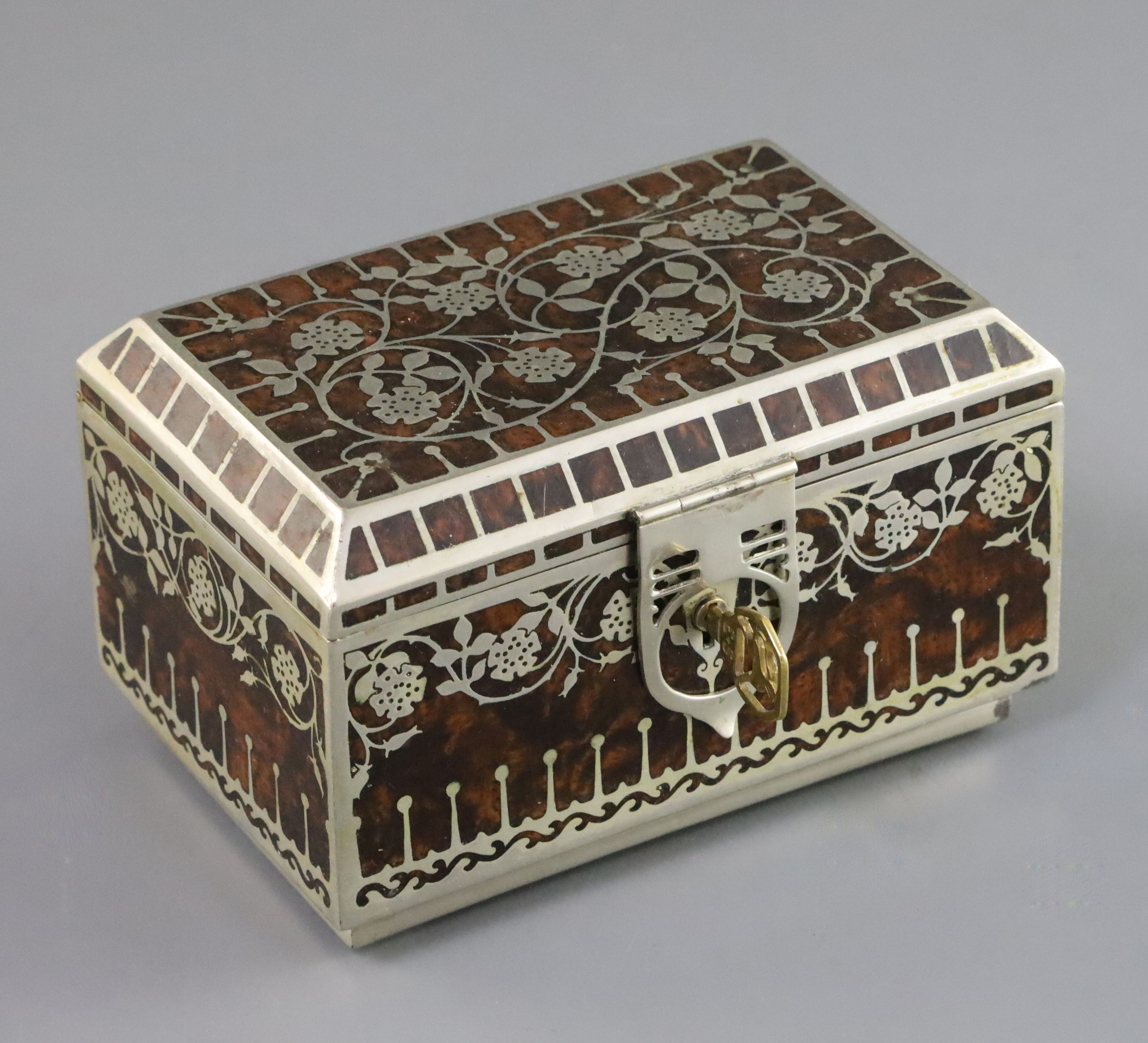 An Erhard and Sohne silvered metal and burr wood casket, decorated with dog roses, 5in., with key