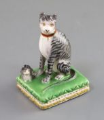 A Derby porcelain group of a seated tabby cat and kitten, c.1810-25, on a green rectangular