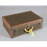 A Louis Vuitton suitcase, with brass mounted leather banded LV fabric and internal tray, no.