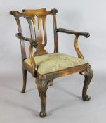 A George II red walnut elbow chair, with needlepoint drop-in seat, acanthus carved cabriole legs and