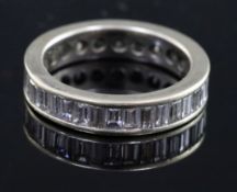 A white gold and baguette cut diamond set full eternity ring, set with twenty three stones, size L.