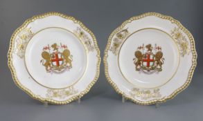 A pair of Spode armorial dinner plates, c.1825, each bearing the arms of the East India Company