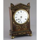 A Regency brass inset mahogany mantel timepiece, with architectural case and enamelled Roman dial,