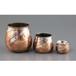 A graduated set of three Christofle Dinanderie Luc Lanel silver inset copper vases, stamped marks to