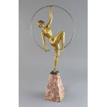 Attributed to G. Limousin. An Art Deco gilt metal figure of a hoop dancer, on tapered marble plinth,