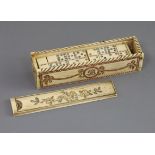 An early 19th century French Prisoner of War set of bone dominoes, with dice, in sliding lidded