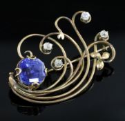 A Ceylonese sapphire and diamond set stylised spray brooch in yellow gold setting, the sapphire of