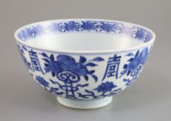 A Chinese blue and white bowl, 16th/17th century, painted with fruit, 'shou' and scrolling tendrils,