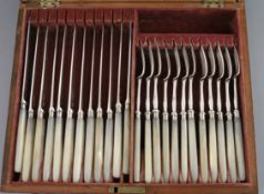 A cased set of twelve pairs of George III/IV mother of pearl handled silver dessert eaters by