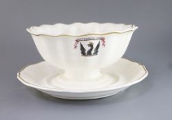 A Spode armorial punch bowl and stand, c.1825, decorated with a crest and the motto 'Nec Temere