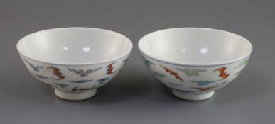 A pair of Chinese doucai 'bat' bowls, Yongzheng mark, Republic period, painted with twelve bats amid
