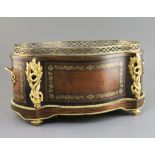 A 19th century French ormolu mounted brass inset specimen wood jardiniere, of serpentine oval