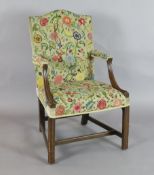 A George III mahogany Gainsborough chair, with moulded arms and chamfered legs, W.1ft 11in. H.3ft