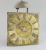 An early 18th century brass and wrought iron birdcage dial wall clock, with verge escapement,