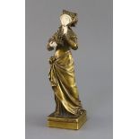 Eugene Bernoud (19th C.). A bronze and ivory figure of La Liseuse, signed, 10.25in.