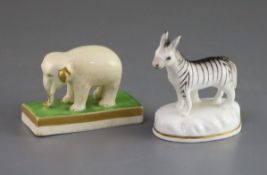 A porcelain figure of an elephant attributed to Davenport and a Staffordshire porcelain zebra, c.