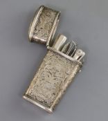 A late 19th/early 20th century continental embossed silver etui case, containing nine assorted