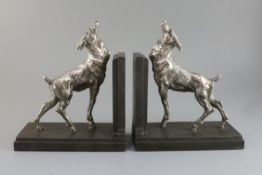 E. Carlier. A pair of silvered and bronzed metal bookends modelled as fawns, signed to the bases,