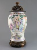 A Chinese famille rose baluster vase, Yongzheng period, finely painted with three sages and an