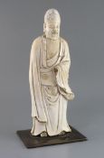 A large Chinese Dehua blanc de chine figure of Shou Lao, 17th/18th century, standing and wearing