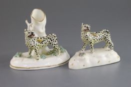 Two Staffordshire porcelain figures of leopards, c.1830-40, each on mound bases, one standing before