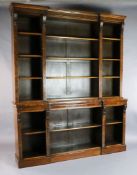 A Victorian figured walnut inverse breakfront library bookcase, fitted three rows of adjustable