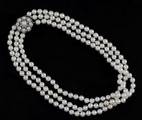 A triple strand cultured pearl choker necklace with 9ct white gold, cultured pearl and diamond set