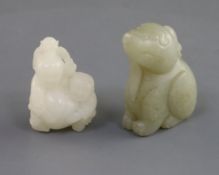 A Chinese white jade 'two boys' carving and a celadon jade lion-dog, the boys clasping a giant peach