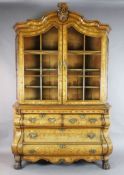 A 19th century Dutch floral marquetry and oak bombé base display cabinet, with scroll capped