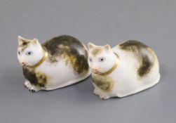 Two Derby porcelain figures of recumbent cats, c.1830, each with tortoiseshell markings, incised '