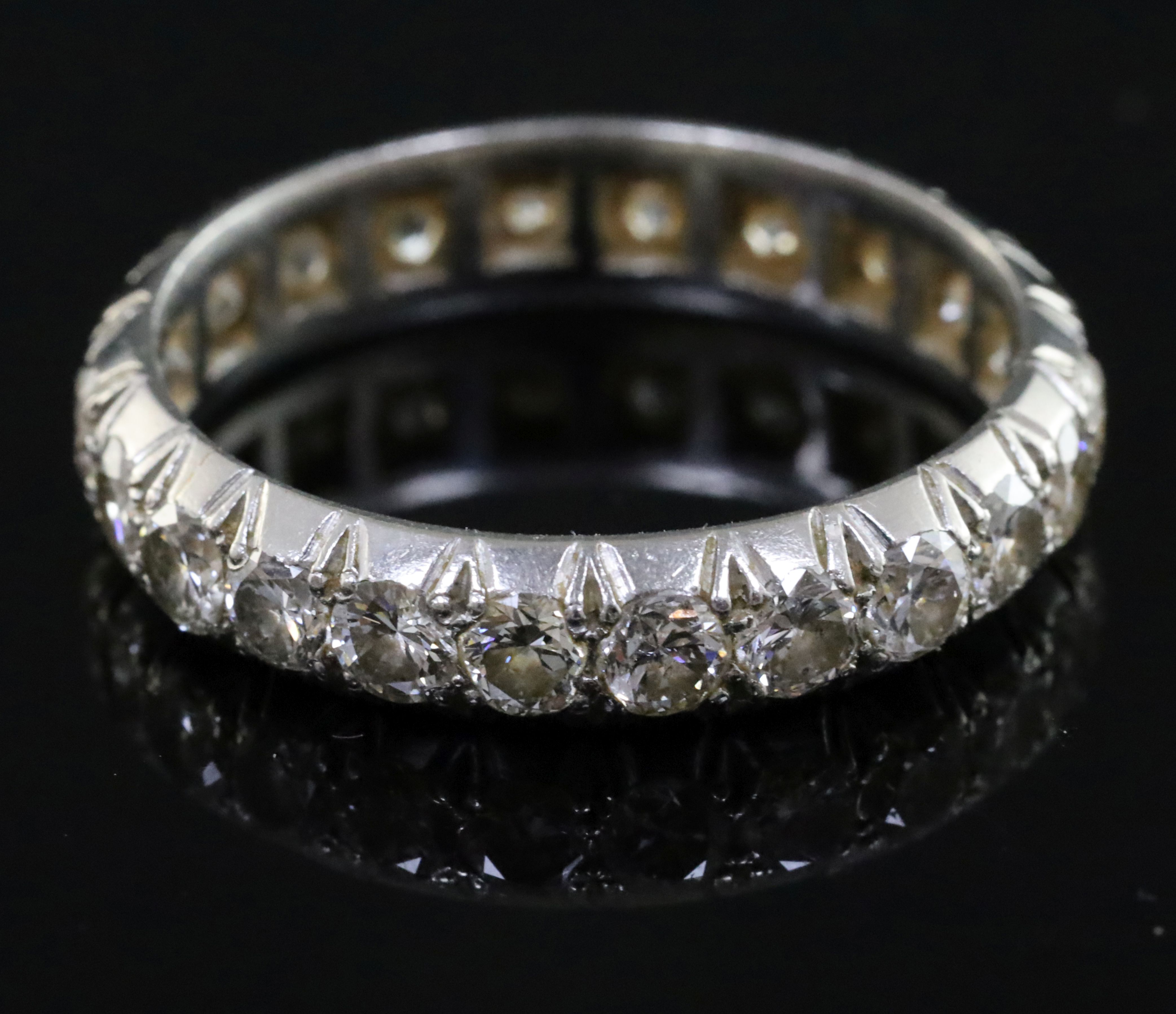 A platinum and diamond set full eternity ring, size O.