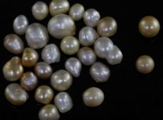 Twenty eight loose undrilled natural saltwater pearls, with Gem & Pearl Laboratory report date 23/