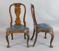 A pair of George II walnut dining chairs, c.1730, with scallop shell capped solid splats and drop-in
