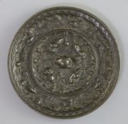 A Chinese bronze 'squirrels and grapes' mirror, Song dynasty or earlier, D. 10cm