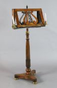 A William IV rosewood duet stand, with lacquered brass candle sconces and telescopic stem
