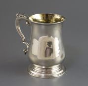 An early George III silver baluster mug, Samuel Whitford I, with acanthus leaf capped handle,