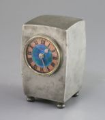 A Liberty & Co. Tudric pewter and enamel timepiece, model no.0756, of swollen rectangular form on