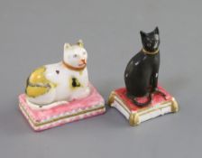 Two Derby porcelain figures of cats, c.1810-30, the first a black cat seated on a pink tasselled