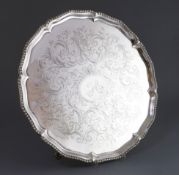 A George III silver salver, by John Cox, with gadrooned border and engraved scroll decoration and