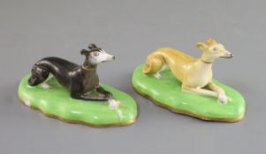 A pair of Copeland & Garrett porcelain figures of greyhounds, c.1833-47, each recumbent on a shallow