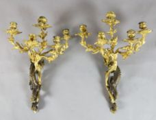 A pair of 19th century French Louis XVI style five light bronze and ormolu wall lights, modelled