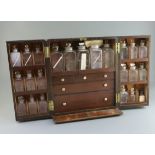 A Victorian brass mounted mahogany apothecary chest, fitted with twenty one glass jars, two later