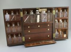 A Victorian brass mounted mahogany apothecary chest, fitted with twenty one glass jars, two later
