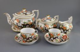 A Newhall porcelain Imari tea and coffee set, c.1815-20, comprising a teapot, cover and stand,